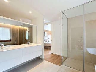 Step into luxury with this stunning bathroom, featuring a sleek, modern design.