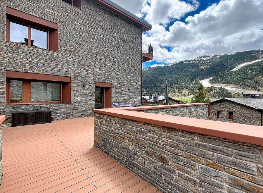 Discover the charm of this stunning property, boasting a beautiful stone facade and a spacious outdoor deck.