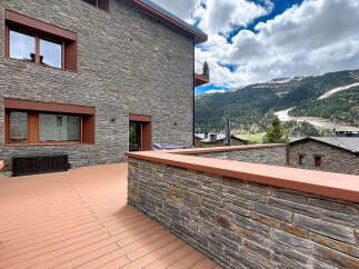 Discover the charm of this stunning property, boasting a beautiful stone facade and a spacious outdoor deck.