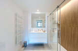 Step into a modern bathroom oasis, meticulously designed for both style and functionality.