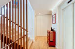 This stunning property boasts a modern interior with a beautiful wooden staircase and a bright, inviting hallway.