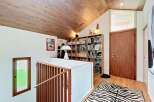 This stunning property boasts a unique architectural design with a cozy and inviting interior.