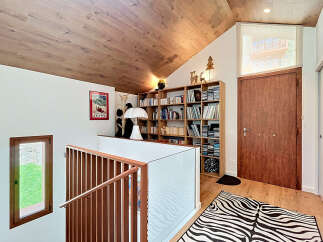 This stunning property boasts a unique architectural design with a cozy and inviting interior.