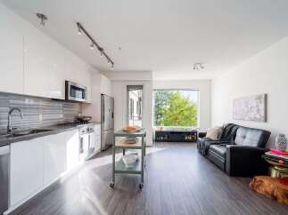 Experience modern living in this stunning property! This home boasts a sleek, contemporary kitchen with stainless steel appliances and ample counter space.