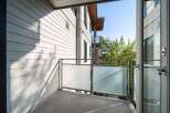 Enjoy the fresh air and stunning views from this modern balcony.