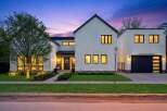 This stunning modern farmhouse boasts a striking exterior with clean lines and a welcoming entrance.