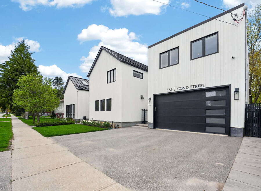 Discover modern living at 189 Second Street! This stunning property boasts a sleek, contemporary design with a striking black and white facade.