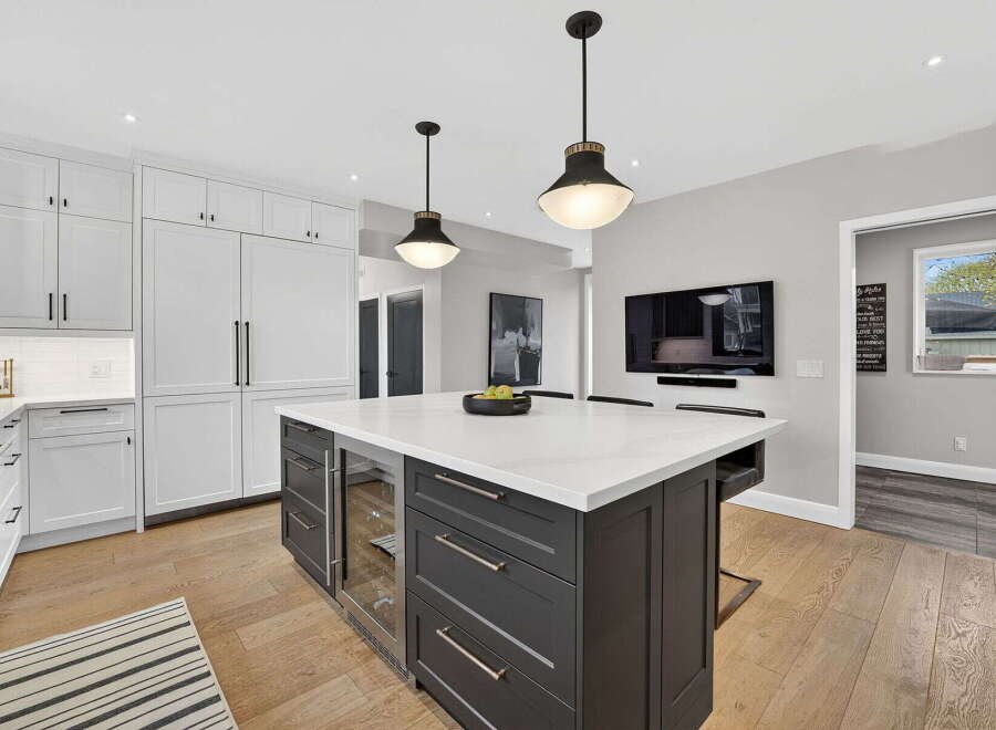 This stunning kitchen boasts a modern design with a large island, perfect for entertaining.