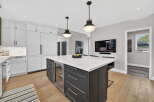 This stunning kitchen boasts a modern design with a large island, perfect for entertaining.