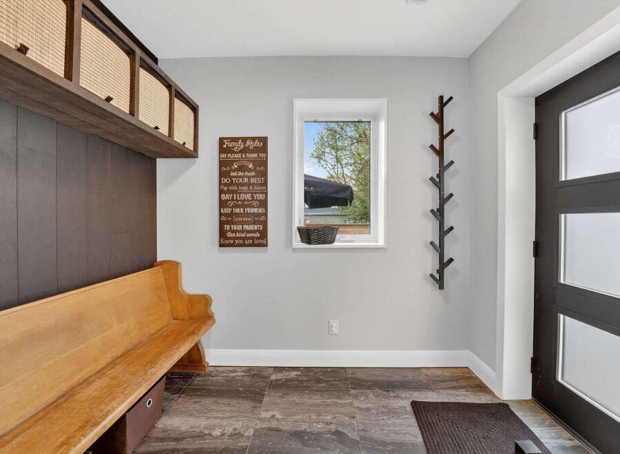 Step into this inviting entryway, showcasing a blend of functionality and style.