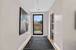 Step into this inviting hallway, showcasing a modern aesthetic with its sleek design and neutral color palette.