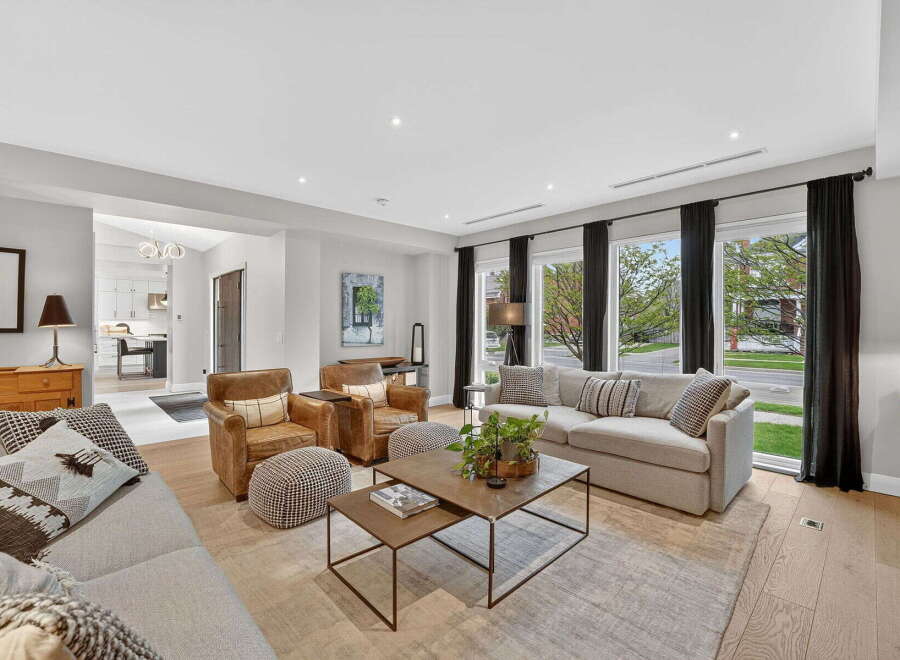 Step into luxury with this stunning living room, featuring a spacious layout and elegant design.