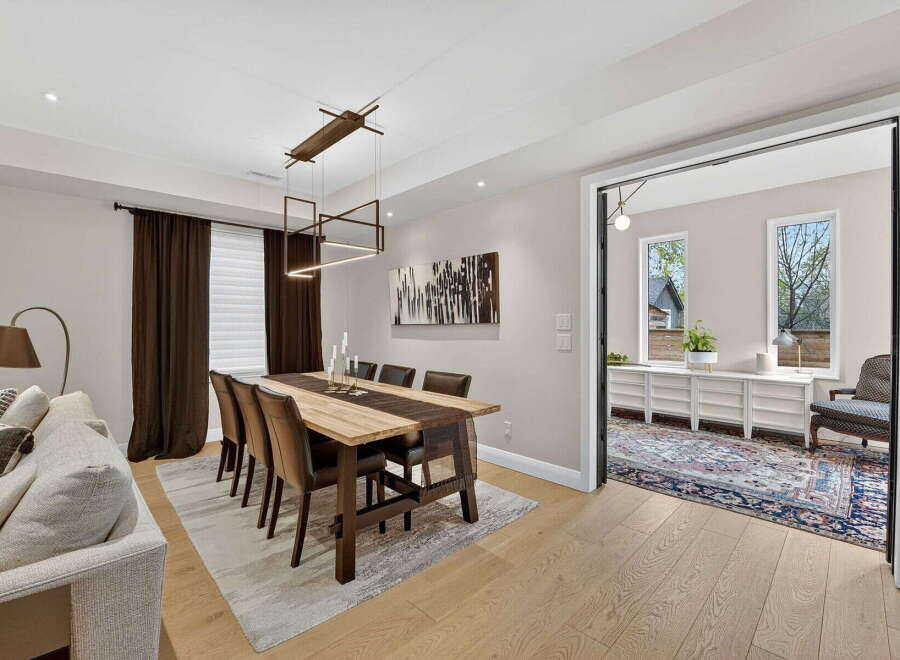 Step into luxury with this stunning dining room, featuring a modern aesthetic and elegant design.