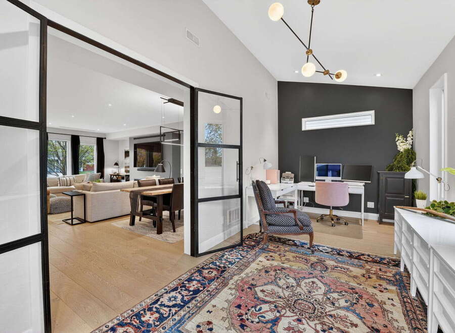 Step into luxury with this stunning property featuring a modern home office.