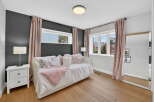This stunning bedroom boasts a cozy daybed, perfect for relaxation.