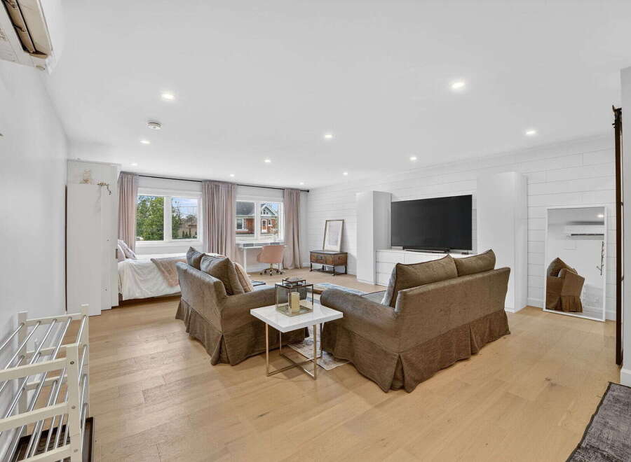 Step into luxury with this stunning property, featuring a spacious living area perfect for relaxation and entertainment.