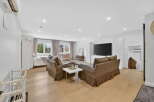 Step into luxury with this stunning property, featuring a spacious living area perfect for relaxation and entertainment.