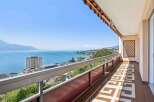 Enjoy breathtaking views from this stunning property! This home features a spacious balcony overlooking the serene lake and surrounding mountains.