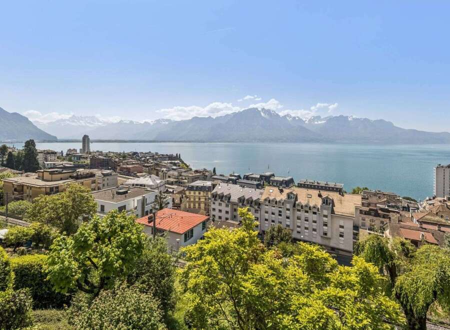 Enjoy breathtaking views of the lake and mountains from this stunning property.