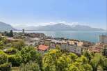 Enjoy breathtaking views of the lake and mountains from this stunning property.