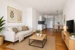 Discover modern living in this stylish apartment! Featuring a bright and airy living room with a comfortable sofa, a sleek kitchen, and a dining area perfect for entertaining.