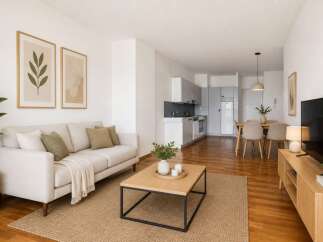 Discover modern living in this stylish apartment! Featuring a bright and airy living room with a comfortable sofa, a sleek kitchen, and a dining area perfect for entertaining.