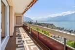 Enjoy breathtaking views from this stunning balcony overlooking the city and the serene lake.