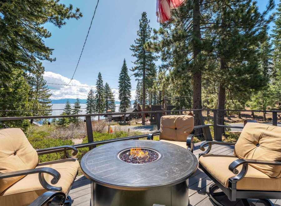 Enjoy breathtaking views from this stunning property featuring a cozy outdoor fire pit, perfect for relaxing evenings.