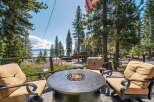 Enjoy breathtaking views from this stunning property featuring a cozy outdoor fire pit, perfect for relaxing evenings.