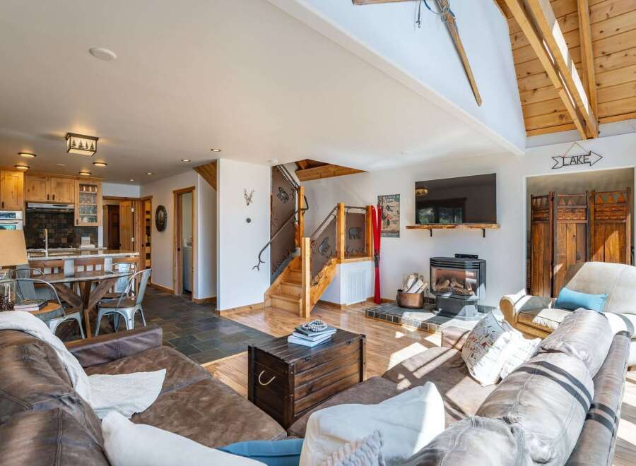 This stunning property boasts a cozy living room with a fireplace, perfect for relaxing evenings.