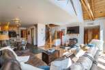 This stunning property boasts a cozy living room with a fireplace, perfect for relaxing evenings.