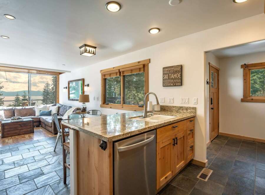 This stunning kitchen boasts a modern design with granite countertops and stainless steel appliances.