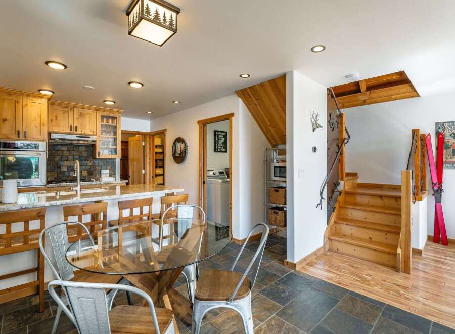 Step into this stunning property featuring a beautifully designed kitchen with custom cabinetry and a stylish breakfast bar.