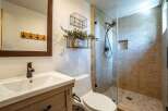 Step into a beautifully designed bathroom featuring a modern glass shower and stylish fixtures.