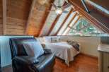 Discover the charm of this cozy loft bedroom, perfect for a relaxing retreat.