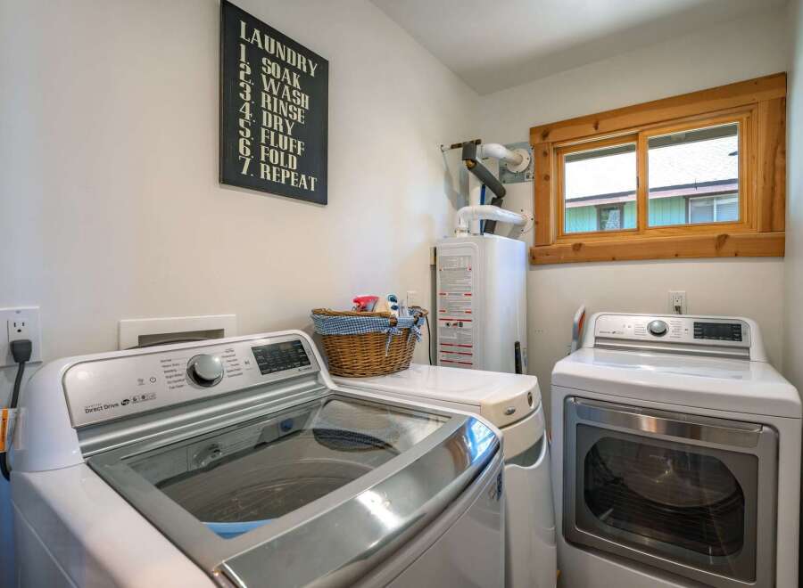 This laundry room offers a functional and stylish space for your laundry needs.