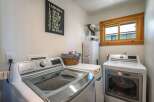 This laundry room offers a functional and stylish space for your laundry needs.