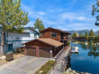 Discover waterfront living at its finest! This stunning property boasts a prime location with direct access to the water, perfect for boating and enjoying scenic views.