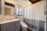 Step into this beautifully designed bathroom, featuring a modern vanity with ample storage and a sleek sink.