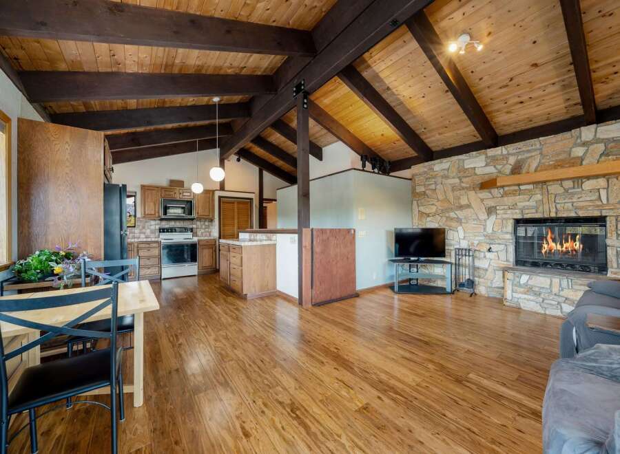 Step into this stunning home featuring a cozy fireplace and a spacious open floor plan.