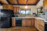 Step into this charming kitchen, featuring warm wooden cabinetry and a classic design.