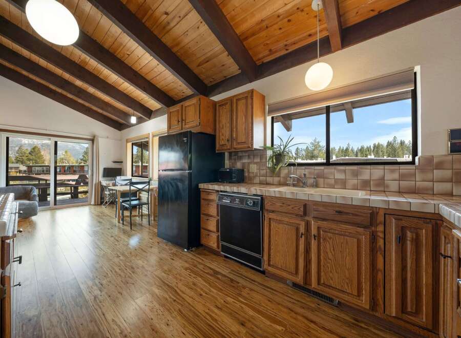 Step into this charming kitchen, featuring warm wooden cabinetry and a classic design.