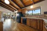 Step into this charming kitchen, featuring warm wooden cabinetry and a classic design.