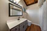 Step into this beautifully designed bathroom, featuring a modern vanity with ample storage and a sleek countertop.