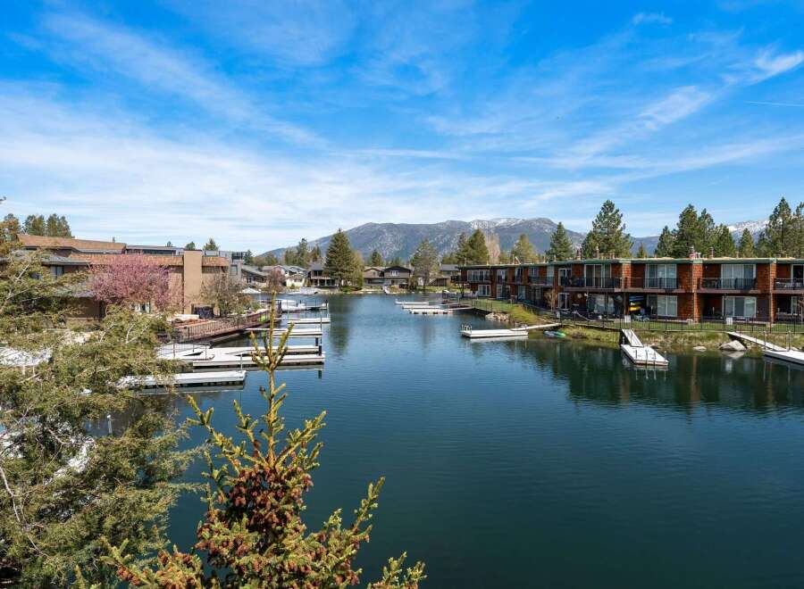 Discover waterfront living at its finest! This stunning property boasts breathtaking views of the lake and surrounding mountains.