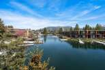 Discover waterfront living at its finest! This stunning property boasts breathtaking views of the lake and surrounding mountains.