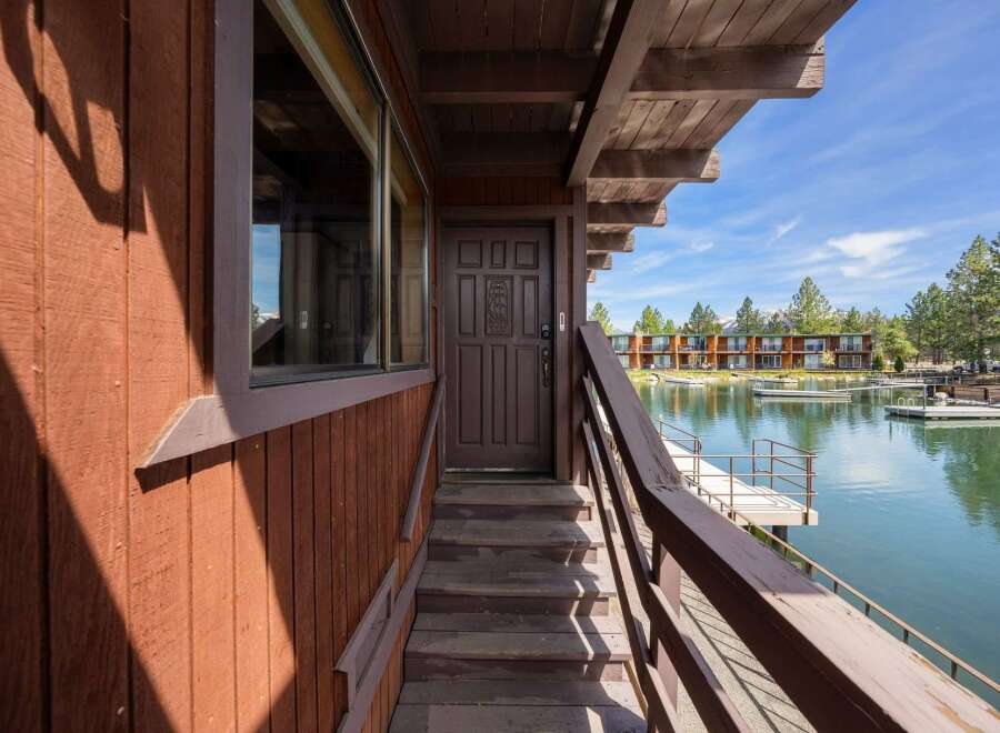 Discover waterfront living at its finest! This charming property boasts a private entrance with a stunning lake view.