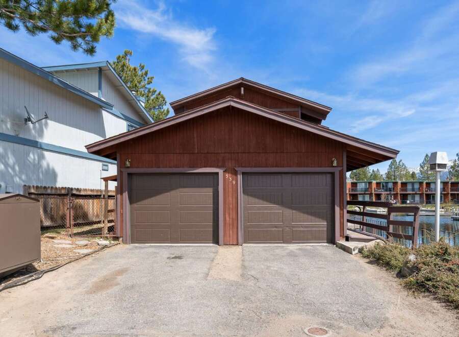 This charming property features a two-car garage with a classic design, perfect for storing vehicles and other belongings.