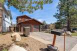 This charming property boasts a beautiful wooden exterior and a convenient two-car garage.