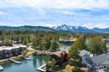 Discover your dream waterfront retreat! This stunning property boasts a prime location with direct lake access and breathtaking mountain views.